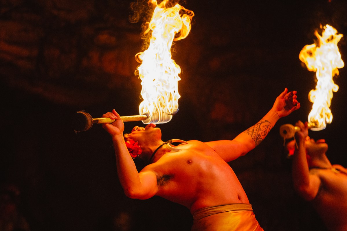 FIRE-EATING_BD__93281 Two men on stage breathing fire