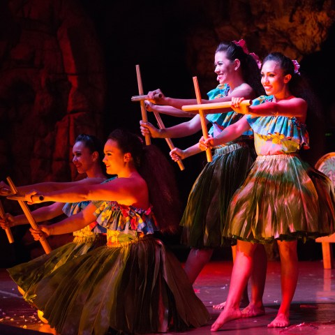 Four women on stage dancing