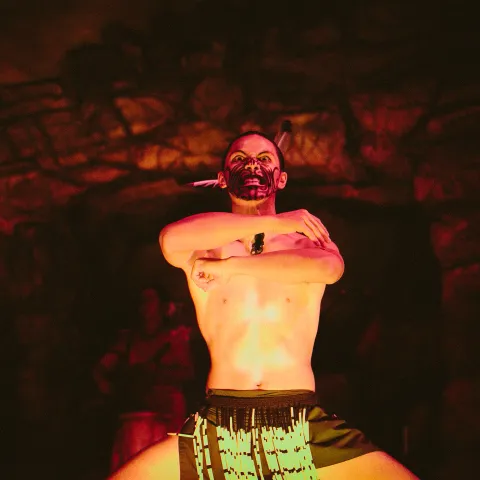 A Maori man looking fierce on stage