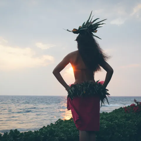A woman looking out at the sunset