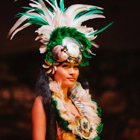 A woman wearing a tiare flower crown