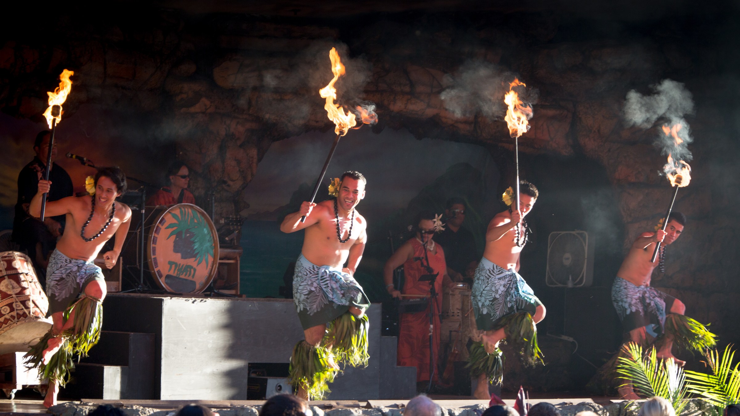 Two men dancing with torches