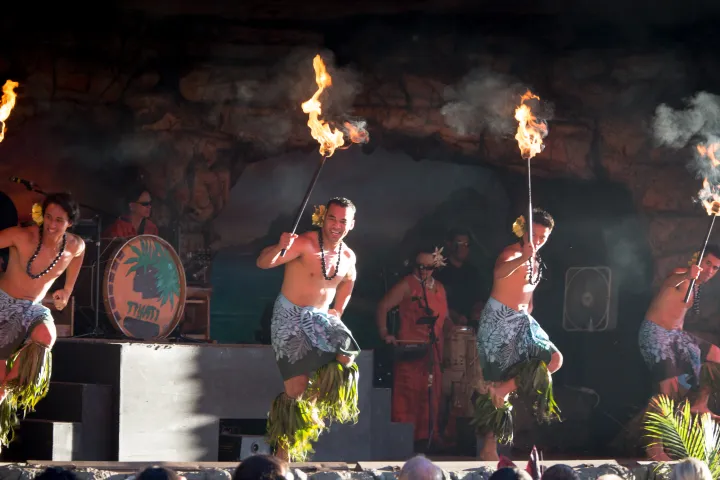 Two men dancing with torches