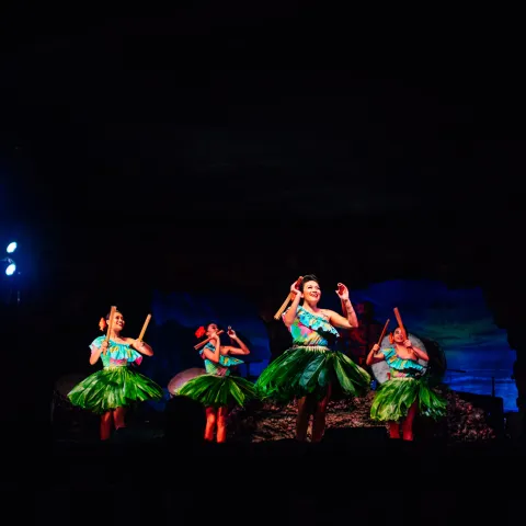 a group of people in a dark room